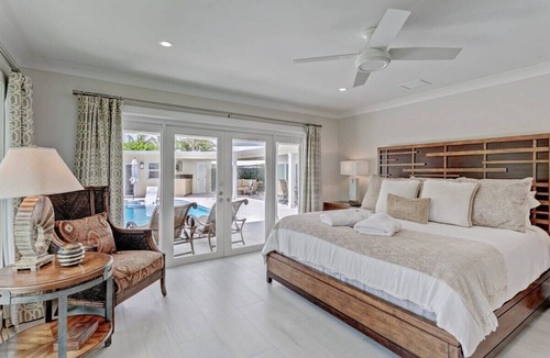 Singer Island Villa | 5 Min Walk to Beach ~ Heated Pool ~ Dock ~ Bikes