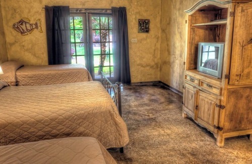 Sabinal Cabin | 6-bedroom Lodge on 12 acres in Concan, Texas. Swimming pool & hot tub.