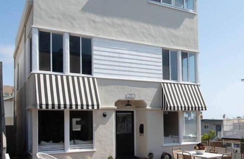 The Strand House | 7 Bedroom Ohana Beach House*Steps to Sand*Patios