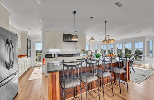 West Beach House | 7-bedroom water view compound with elevator featuring a main house and annex.