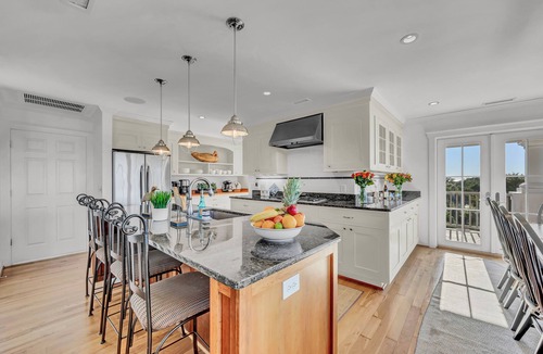 West Beach House | 7-bedroom water view compound with elevator featuring a main house and annex.