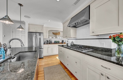 West Beach House | 7-bedroom water view compound with elevator featuring a main house and annex.