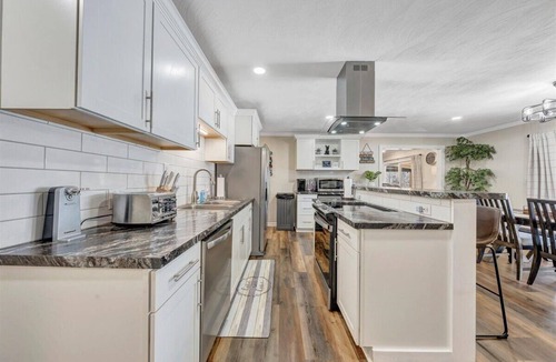 North Shore House | 7BR/5BA SML Lakefront – Walk to Private Dock w/Boat Lifts, Fire Pit & Views!