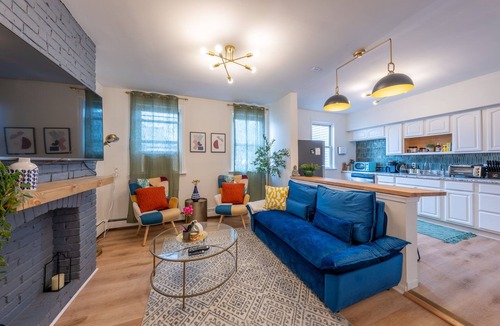 The Heights House | 7BR 5BTH Steps to Bars, Dining, NYC Access with GameRm, Backyard, BBQ, Parking
