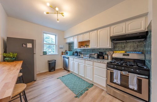 The Heights House | 7BR 5BTH Steps to Bars, Dining, NYC Access with GameRm, Backyard, BBQ, Parking