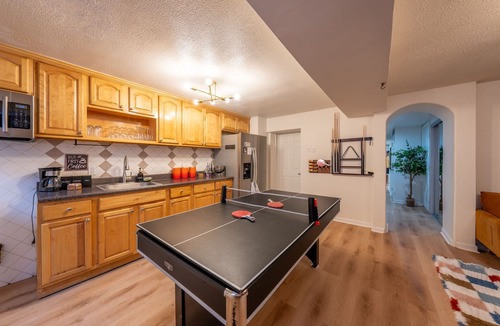 The Heights House | 7BR 5BTH Steps to Bars, Dining, NYC Access with GameRm, Backyard, BBQ, Parking