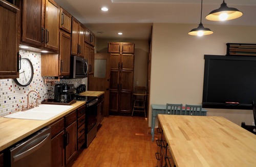 Oskaloosa Apartment | A Class-y & spacious 1500 square foot retreat in a century old brick schoolhouse