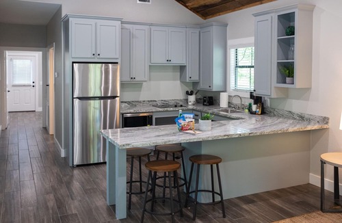 Livingston Cabin | A Cozy ADA Accessible Getaway Right on the Water, Two Creeks Crossing Resort