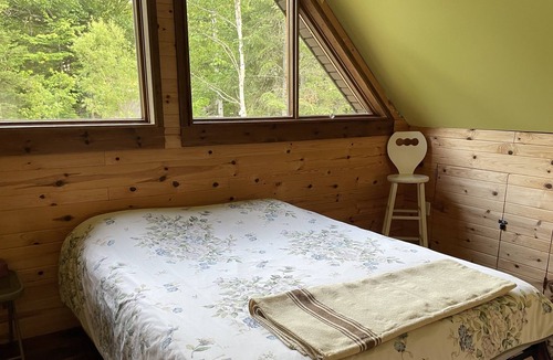 Notre-Dame-Des-Bois Cabin | A cozy rustic mountain side cabin with a small river on the property.