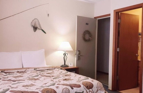 Ironwood Cabin | A fun fishing themed private guestroom for up to 5 inside the Lodge at North Ironwood Acres resort. TWO bathrooms! DOG FRIENDLY!.