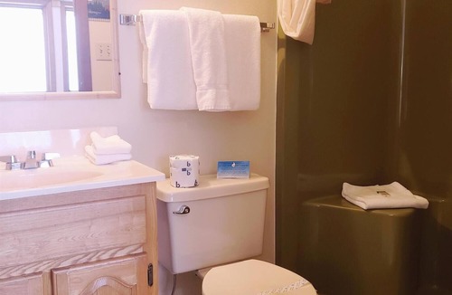 Ironwood Cabin | A fun fishing themed private guestroom for up to 5 inside the Lodge at North Ironwood Acres resort. TWO bathrooms! DOG FRIENDLY!.