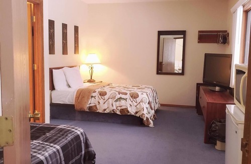 Ironwood Cabin | A fun fishing themed private guestroom for up to 5 inside the Lodge at North Ironwood Acres resort. TWO bathrooms! DOG FRIENDLY!.