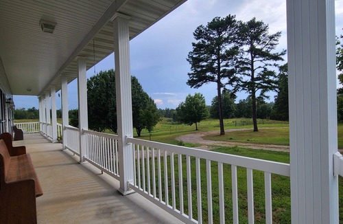 Pomona House | A large country home with scenic views of a working cattle farm & rural locale.