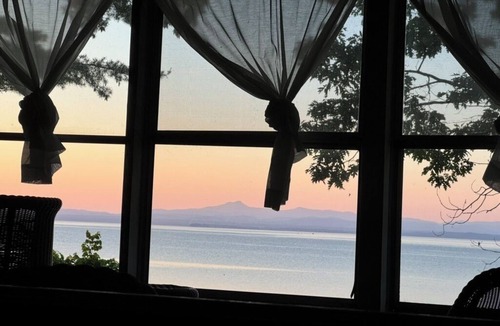 Port Douglass House | A New York camp on Lake Champlain, private pebble beach frontage.