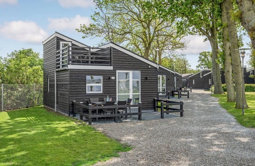 Assens House | A small cottage awaits you here, located on a campsite with a playground.