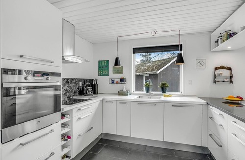 Hojslev House | A stylishly decorated cottage with a cozy ambience.