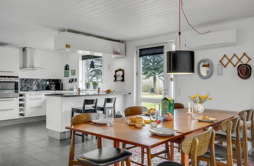 Hojslev House | A stylishly decorated cottage with a cozy ambience.