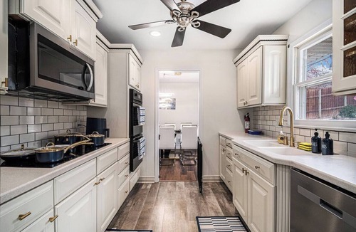 West Omaha House | A Touch of Luxury | Arcade, 5 TVs, Bounce House, Coffee Bar