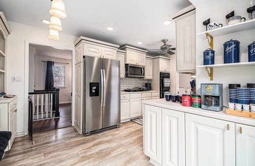 West Omaha House | A Touch of Luxury | Arcade, 5 TVs, Bounce House, Coffee Bar