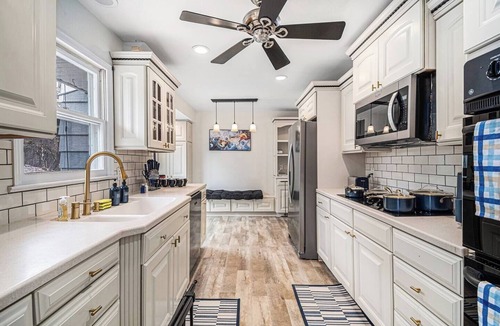 West Omaha House | A Touch of Luxury | Arcade, 5 TVs, Bounce House, Coffee Bar