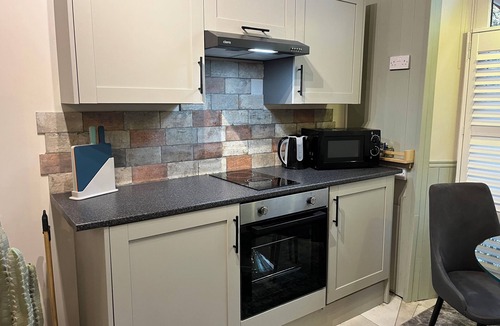 Wadsworth Apartment | Accessible Quiet Studio in Prime Central Location with Log Burner &Private Patio