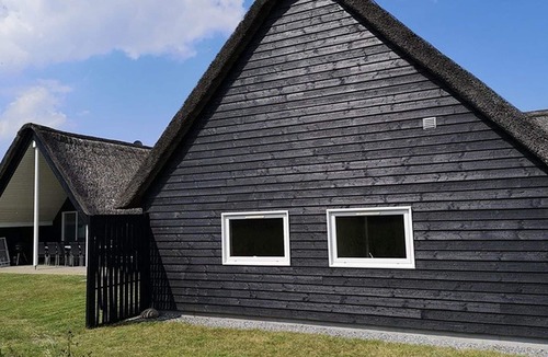 Toftum House | Activity house under thatch with pool, whirlpool, sauna and activity room