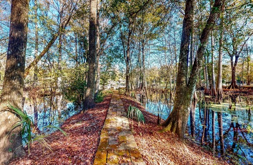 Bushnell Cabin | Adorable A-Frame with Riverfront Yard, Fishing Pier, & Firepit