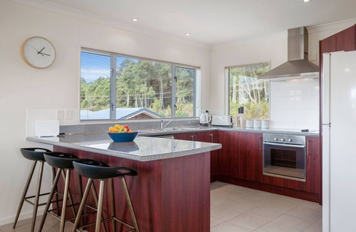 Motuoapa House | Adventure Sika - Relax on the deck with views