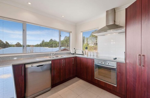 Motuoapa House | Adventure Sika - Relax on the deck with views