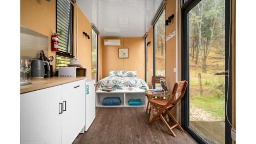 Flowerdale House | Alpaca Tiny House with Vineyard Lakeside by Tiny Away