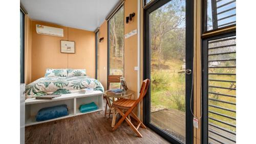 Flowerdale House | Alpaca Tiny House with Vineyard Lakeside by Tiny Away