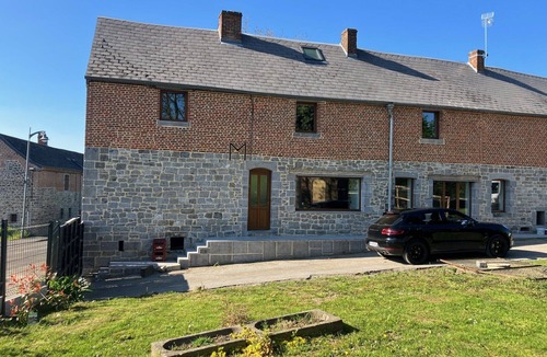 Boussois House | An old-fashioned farmhouse surrounded by animals.