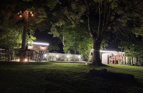 Boussois House | An old-fashioned farmhouse surrounded by animals.