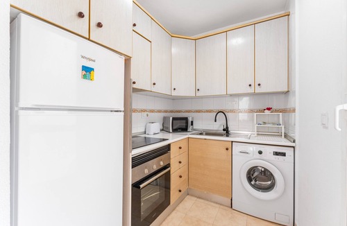 La Zenia Apartment | Apartment 'Buen Ambiente' with Shared Pool, Shared Garden and Wi-Fi