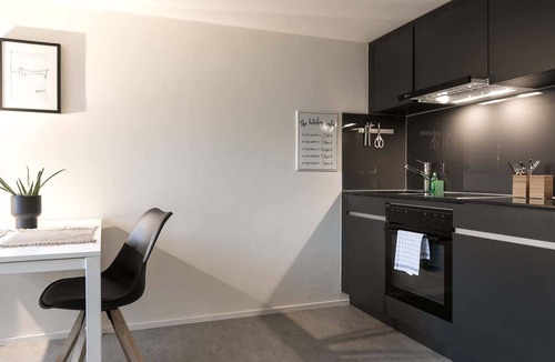 St. Gallen Apartment | Apartment deluxe orange with shower and kitchen