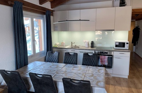Surcuolm Ski Chalet | Apartment house Surselva, directly on the ski piste