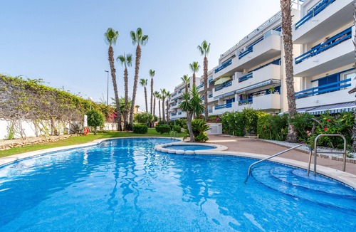 Flamenca Beach Apartment | Apartment 'In Playa Flamenca' with Shared Pool, Wi-Fi and Air Conditioning