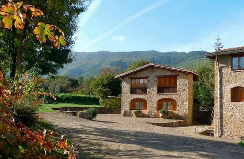 Santa Pau Apartment | Apartment 'Mas El Carrer - Groc' with Mountain View, Shared Pool and Wi-Fi