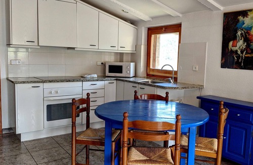 Santa Pau Apartment | Apartment 'Mas El Carrer - Blau' with Shared Pool, Shared Garden and Wi-Fi