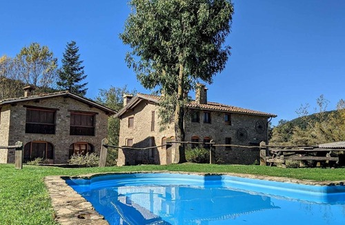 Santa Pau Apartment | Apartment 'Mas El Carrer - Verd' with Shared Pool, Shared Garden and Wi-Fi