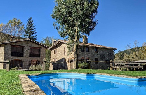 Santa Pau Apartment | Apartment 'Mas El Carrer - Verd' with Shared Pool, Shared Garden and Wi-Fi