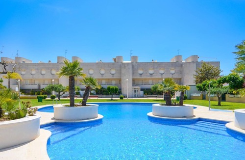 El Roc de Sant Gaieta Apartment | Apartment on the seafront with communal area and pool