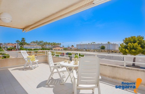 El Roc de Sant Gaieta Apartment | Apartment on the seafront with communal area and pool