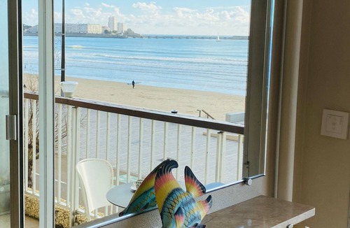 Les Sables d'Olonne Apartment | Apartment with direct beach access, balcony, and private garage