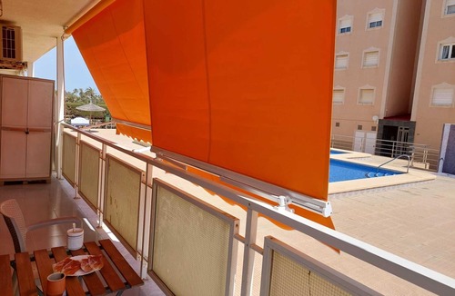 Punta Prima Apartment | Apartment with 2 bedrooms, Wi-Fi, air conditioning, sea view, pool, and garage