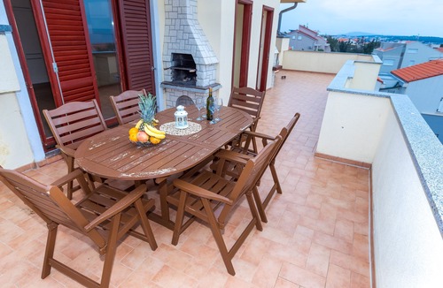 Novalja Apartment | Apartment with Terrace and Partial Sea View and grill