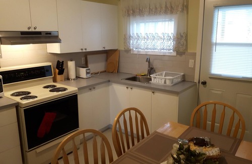 Longueuil Apartment | Appartements Cartier. Free parking. Backyard.