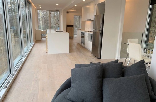 Lac Superieur Village Ski Chalet | Architectural home with panoramic mountain views.