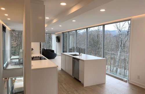 Lac Superieur Village Ski Chalet | Architectural home with panoramic mountain views.