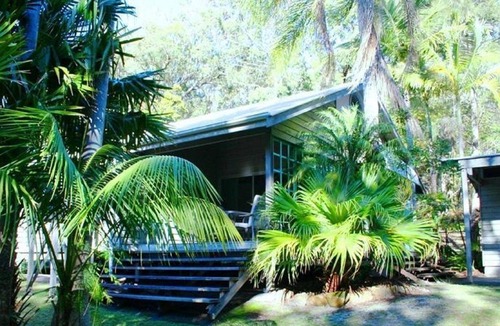 Arakoon Cottage | Architecturally designed beach house with a private covered north facing...